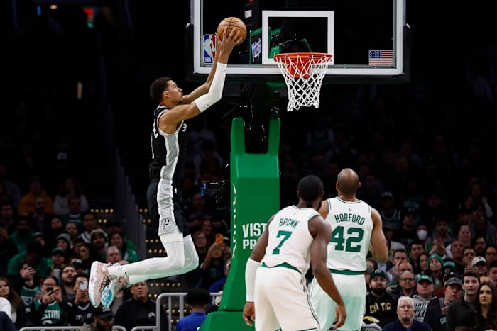 Boston, MA: San Antonio Spurs center Victor Wembanyama (1) dunks while Jaylen Brown (7) and Al Horford (42) of the Boston Celtics look on. Jan. 17, 2024.